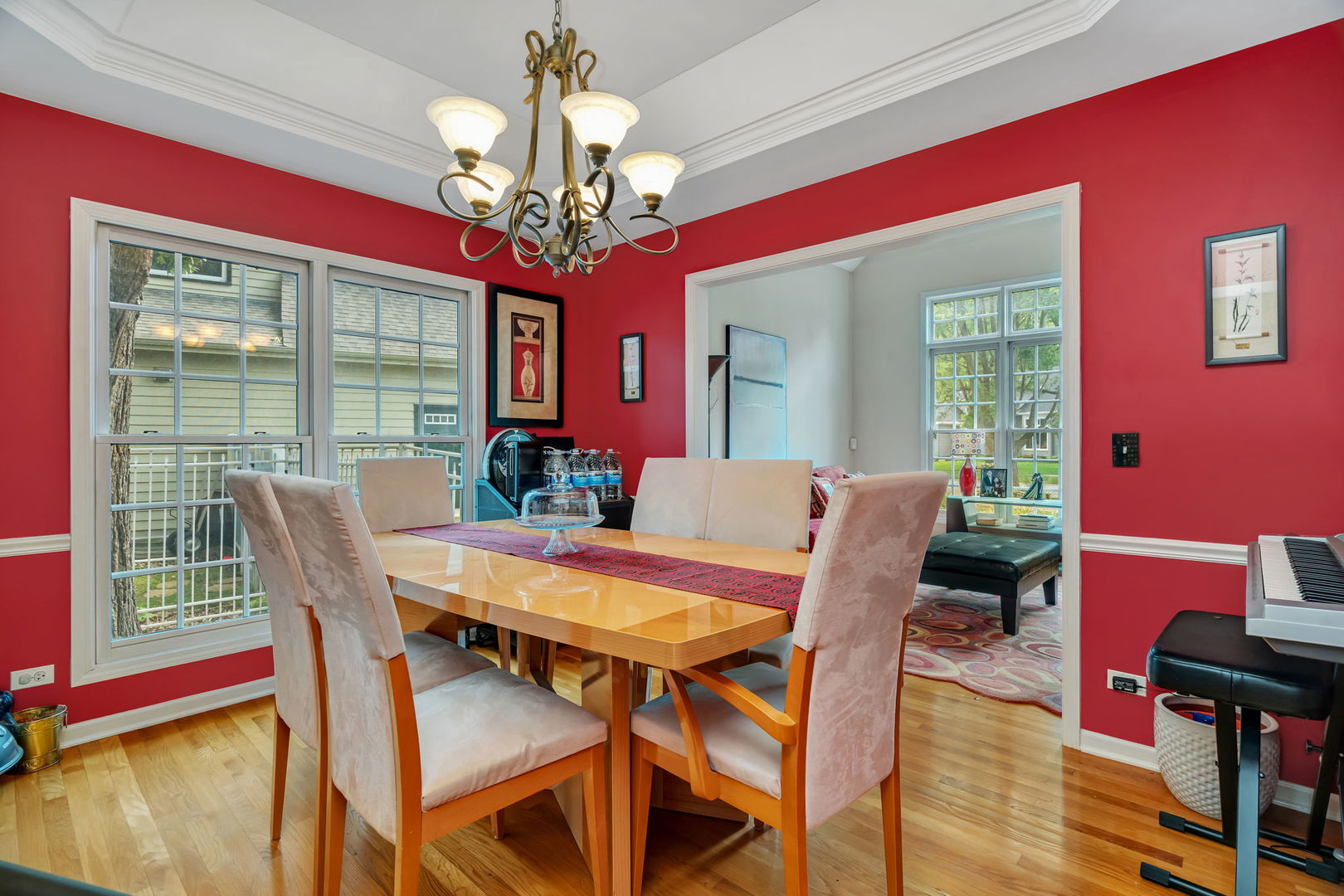 745 Feather Sound Drive Bolingbrook, IL 60440 - Photo 5 of 38 a view of a dining room with furniture a chandelier and wooden floor