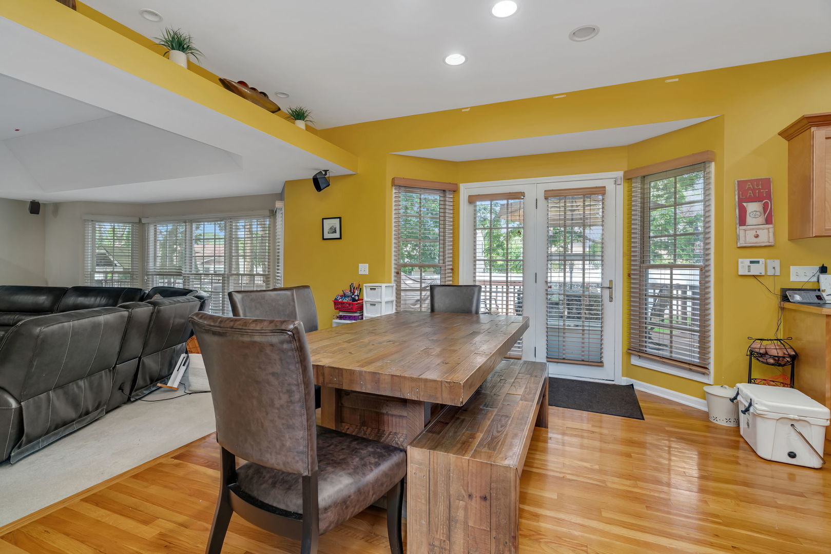 745 Feather Sound Drive Bolingbrook, IL 60440 - Photo 10 of 38 a living room with couches a dining table and chairs with wooden floor