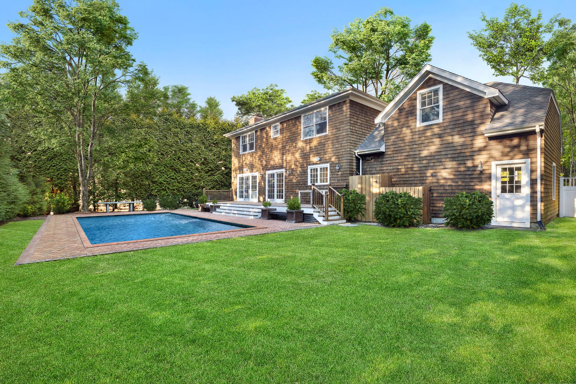 a front view of house with yard and green space