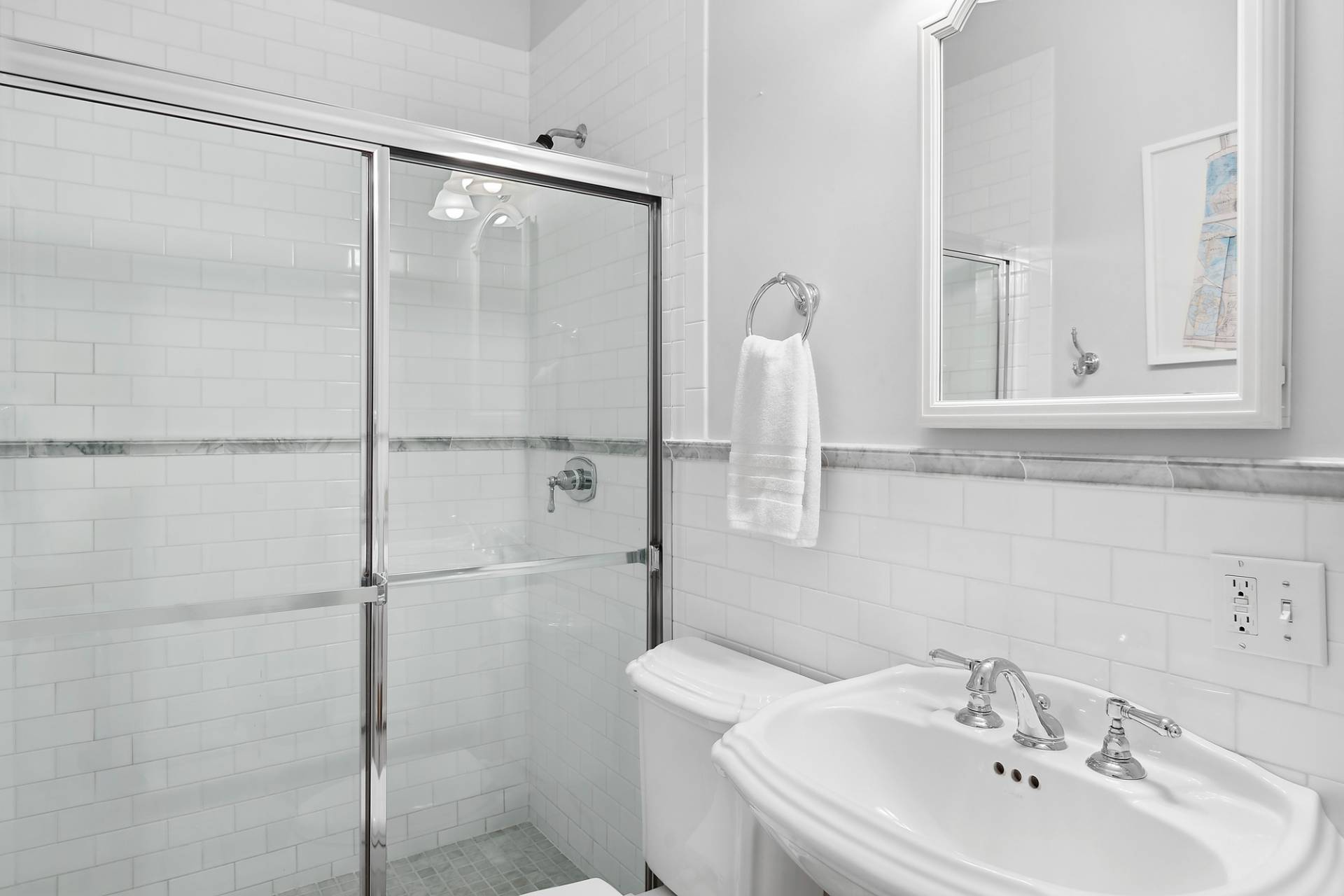 24 Peconic Bay Avenue Southampton, NY 11968 - Photo 11 of 18 a bathroom with a sink a toilet and shower