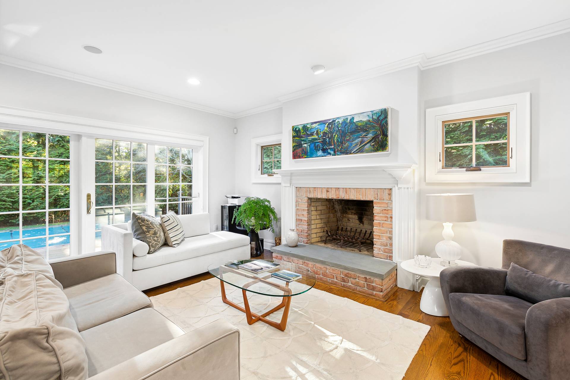 24 Peconic Bay Avenue Southampton, NY 11968 - Photo 3 of 18 a living room with furniture a window and a fireplace