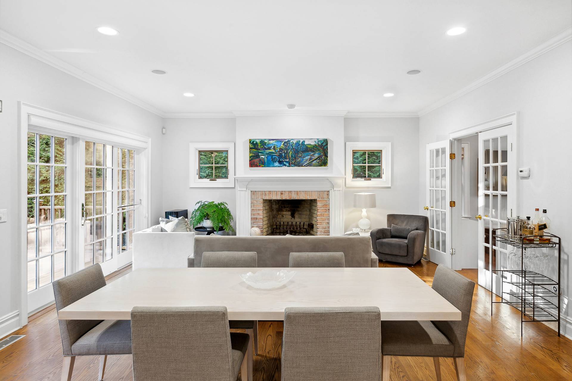 24 Peconic Bay Avenue Southampton, NY 11968 - Photo 4 of 18 a living room with furniture a large window and a fireplace