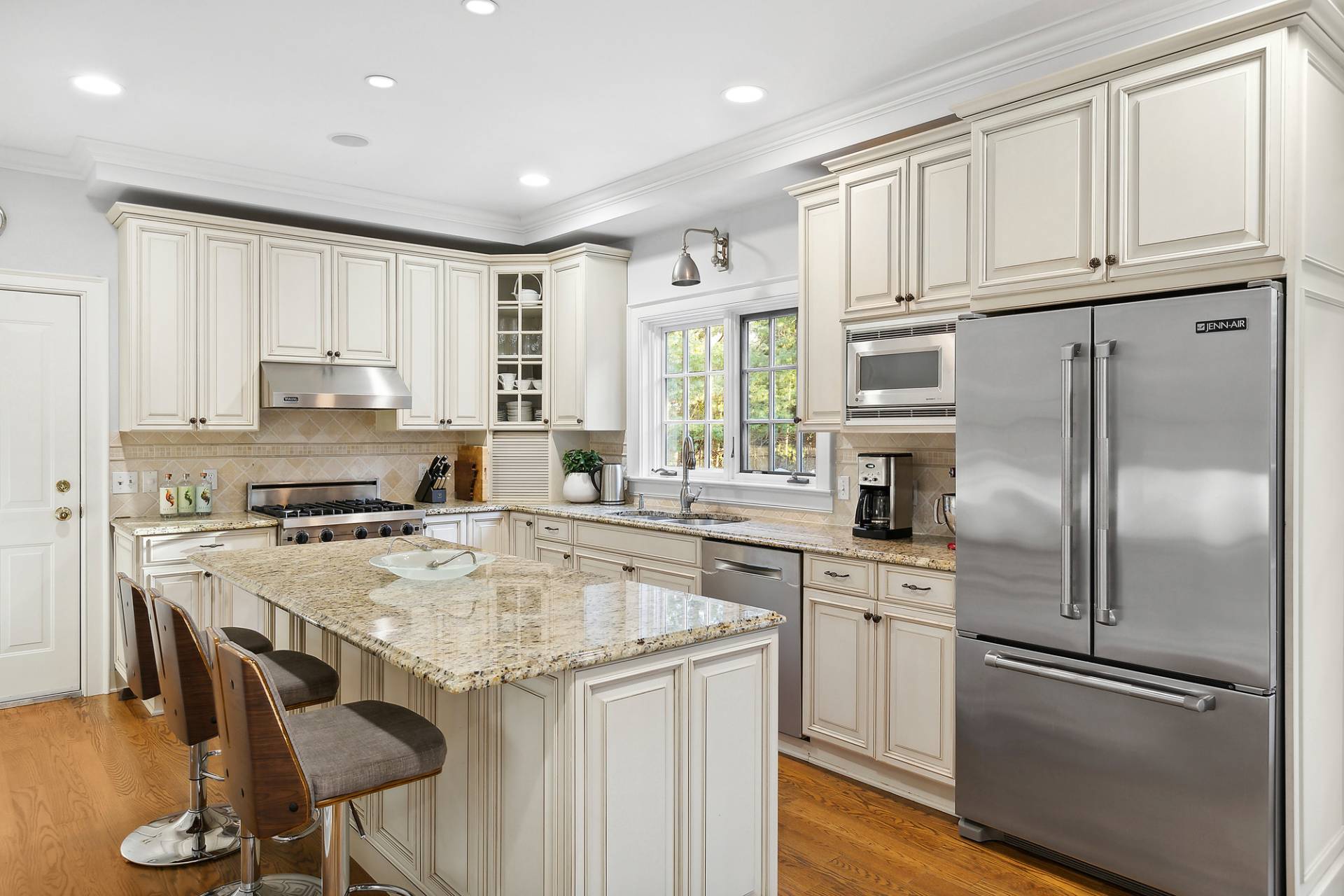 24 Peconic Bay Avenue Southampton, NY 11968 - Photo 5 of 18 a kitchen with appliances cabinets and furniture