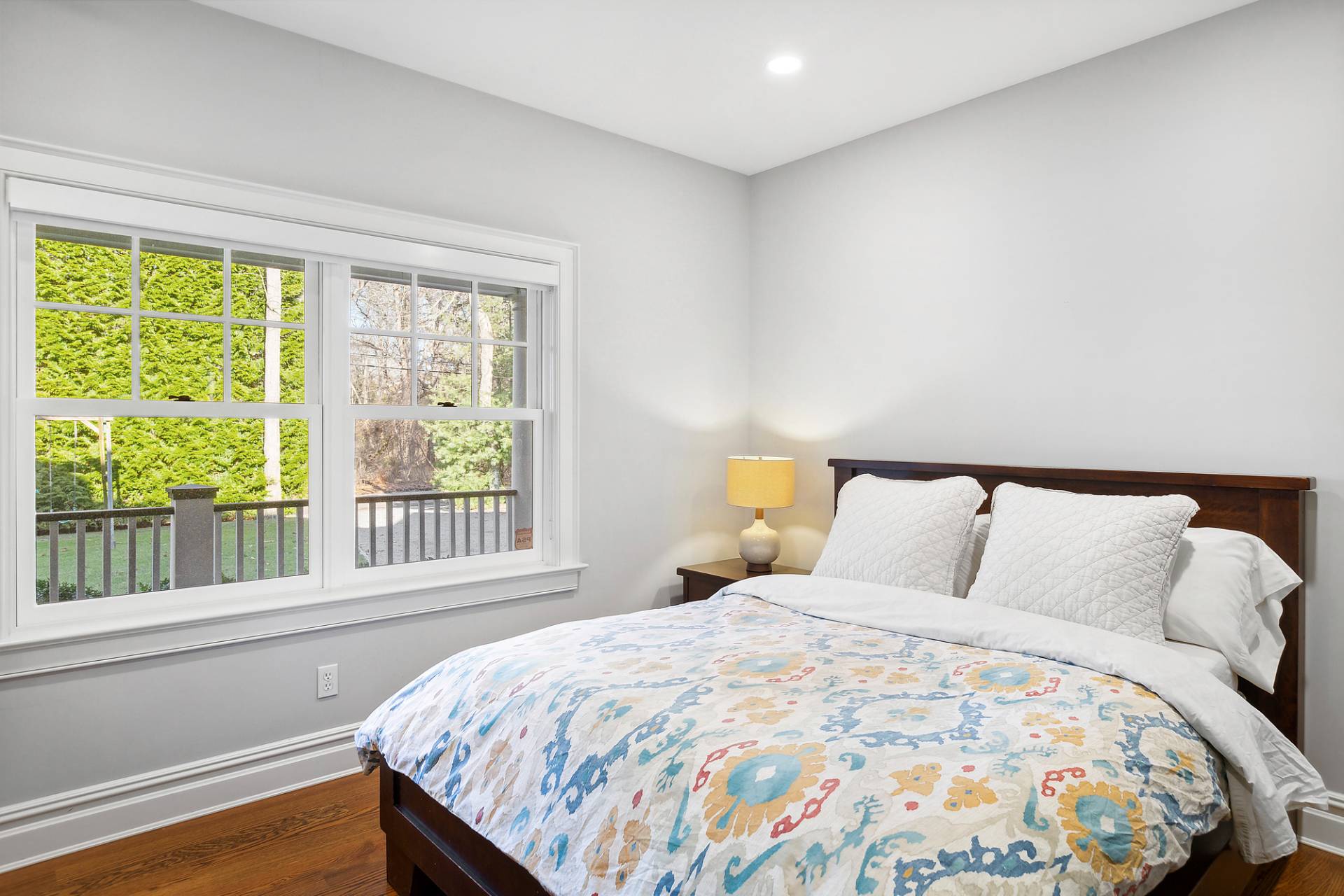 24 Peconic Bay Avenue Southampton, NY 11968 - Photo 10 of 18 a large bed sitting in a bedroom next to a window