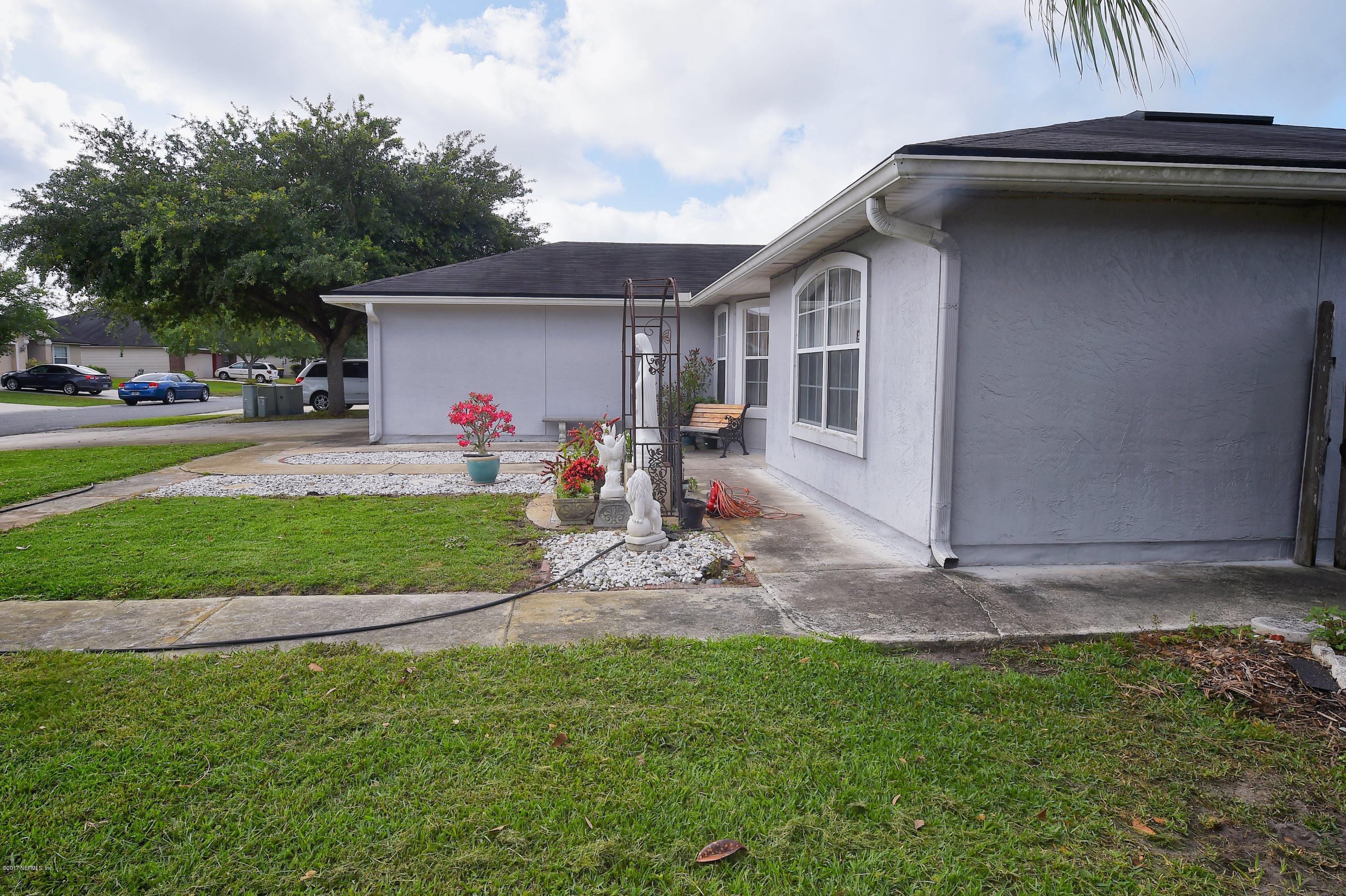 2468 Paris Mill Road Jacksonville, FL 32221 - Photo 2 of 30 a view of a backyard that has a car parked in it
