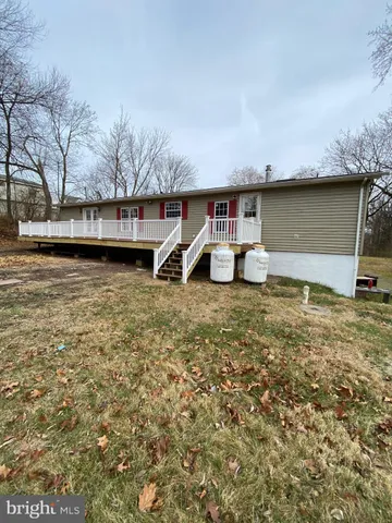 a house with river in front of it
