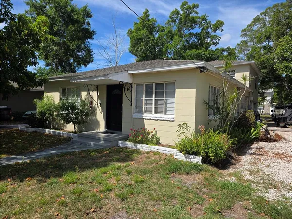 front view of a house with a yard