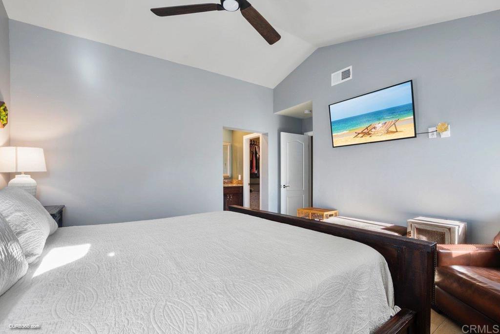 1963 Alderbrook Place Chula Vista, CA 91913 - Photo 14 of 30 a bedroom with a bed and a lamp