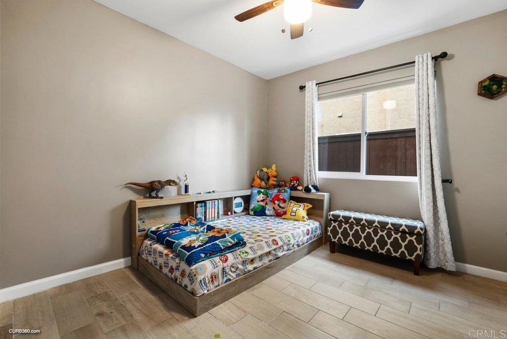 1963 Alderbrook Place Chula Vista, CA 91913 - Photo 19 of 30 a bedroom with furniture and a window