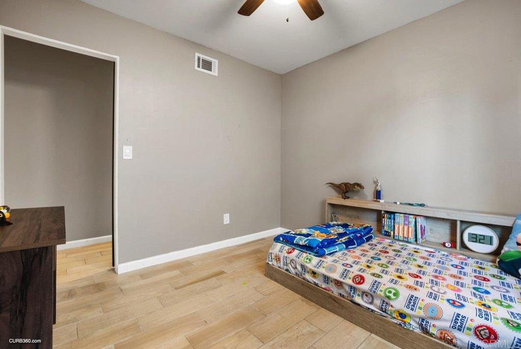 1963 Alderbrook Place Chula Vista, CA 91913 - Photo 20 of 30 a bedroom with bed and a window