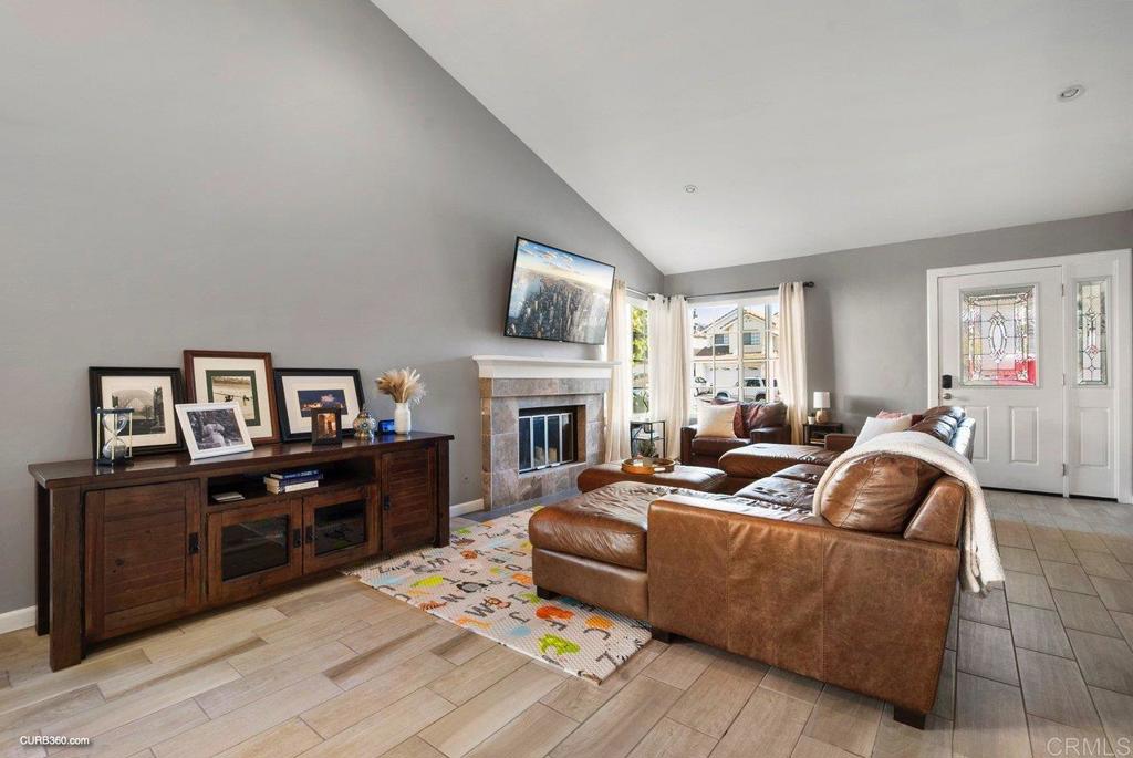 1963 Alderbrook Place Chula Vista, CA 91913 - Photo 2 of 30 a living room with furniture fireplace and flat screen tv