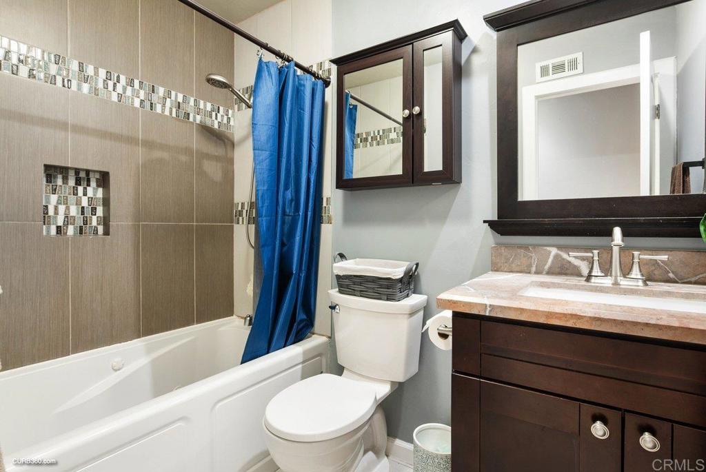 1963 Alderbrook Place Chula Vista, CA 91913 - Photo 21 of 30 a bathroom with a sink a toilet and shower