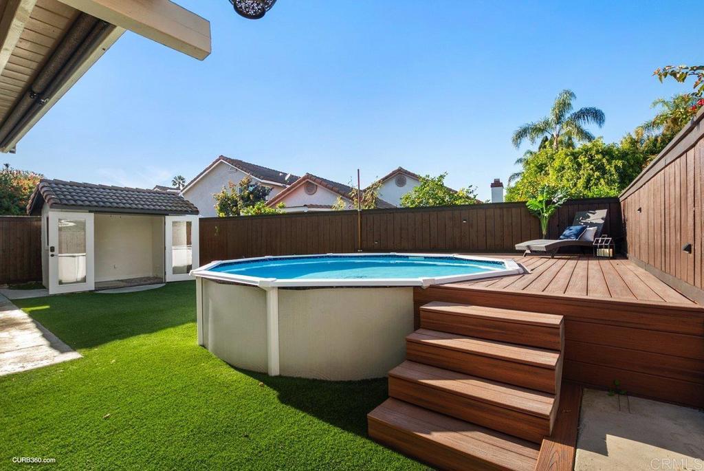 1963 Alderbrook Place Chula Vista, CA 91913 - Photo 23 of 30 a view of a white house with a sink and a yard
