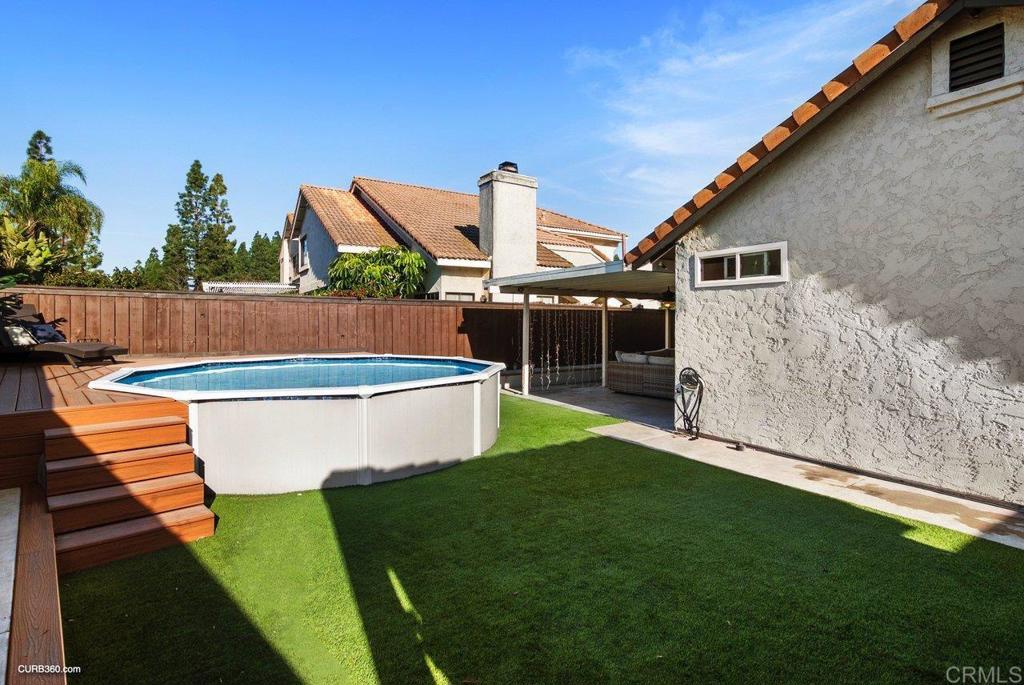 1963 Alderbrook Place Chula Vista, CA 91913 - Photo 26 of 30 a view of a backyard with swimming pool