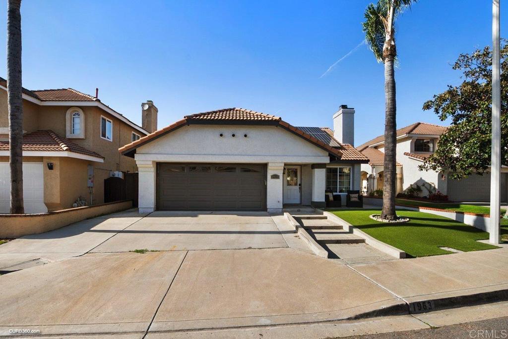 1963 Alderbrook Place Chula Vista, CA 91913 - Photo 29 of 30 a front view of a house with garden