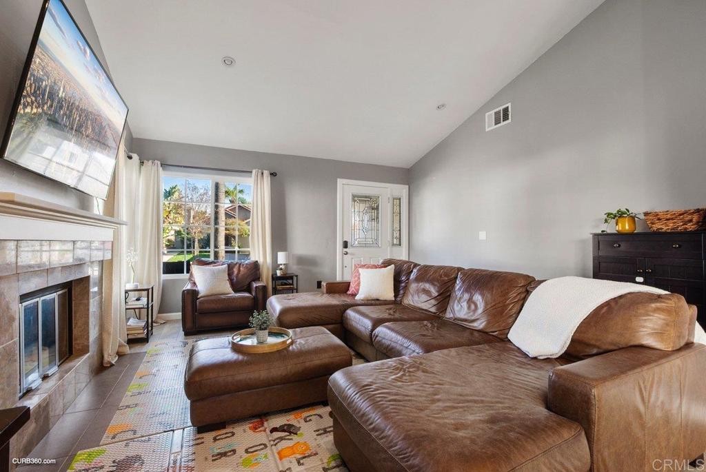 1963 Alderbrook Place Chula Vista, CA 91913 - Photo 3 of 30 a living room with furniture and a fireplace