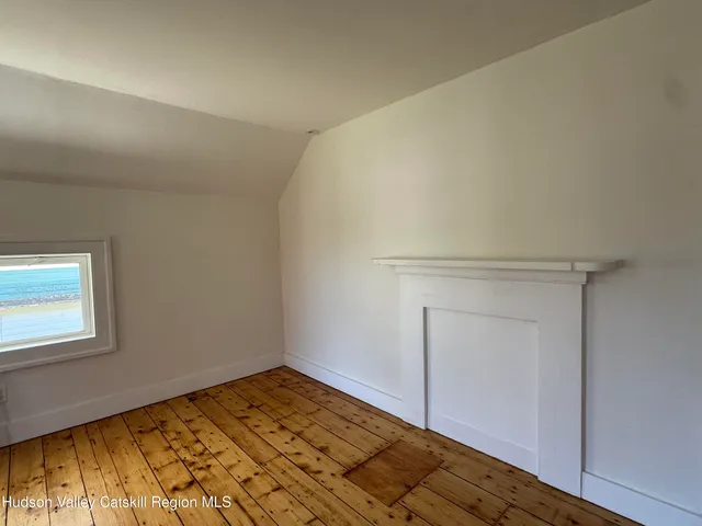a view of a room with wooden floor and closet
