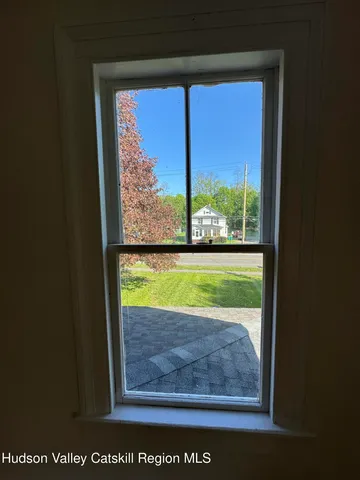 a view of a room with a big yard