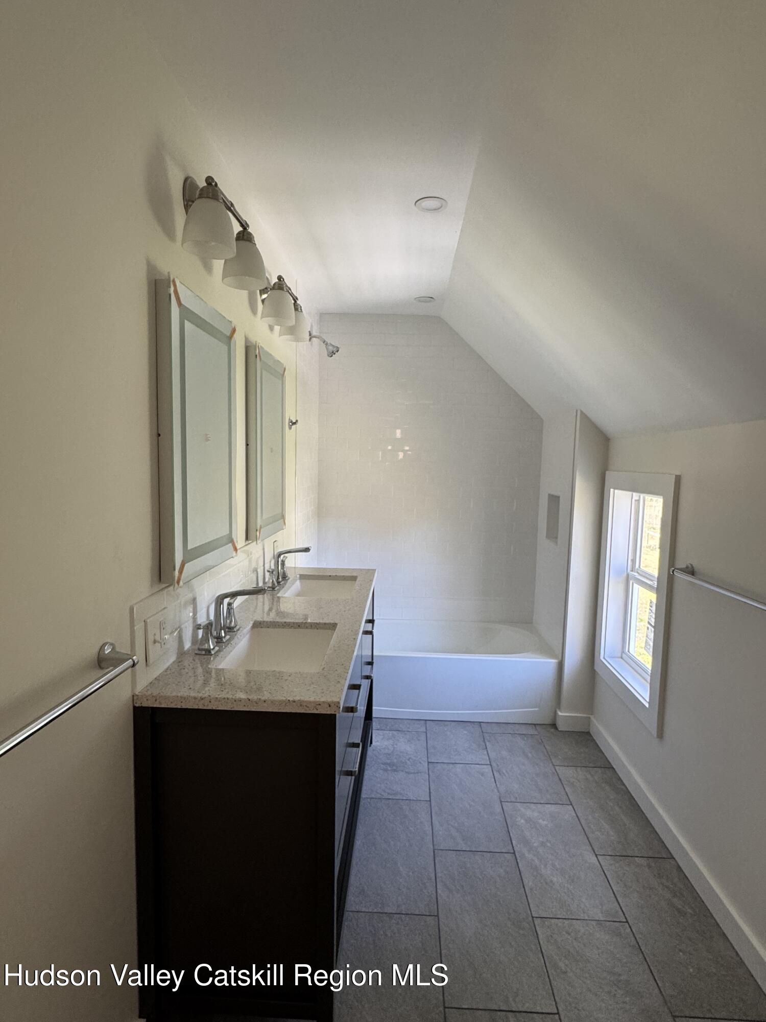 237 Main Street Copake, NY 12516 - Photo 19 of 25 a bathroom with a sink a vanity and a mirror