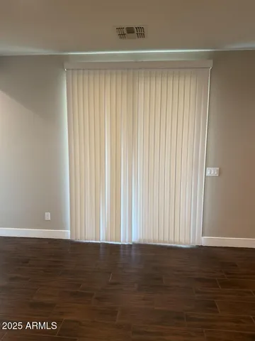 a view of wooden floor and entryway