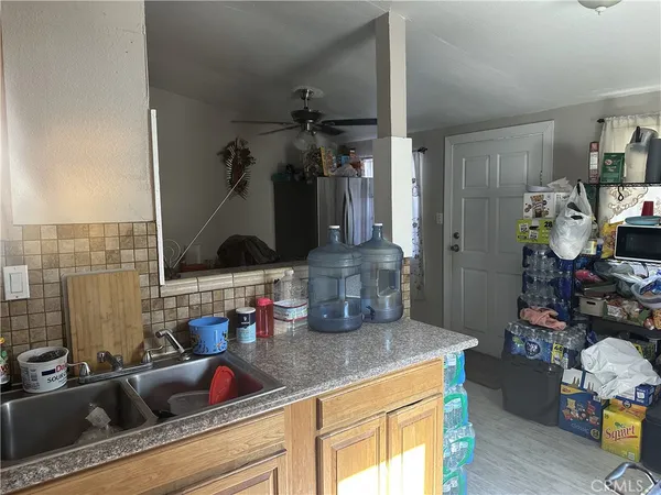 a kitchen with sink and cabinets