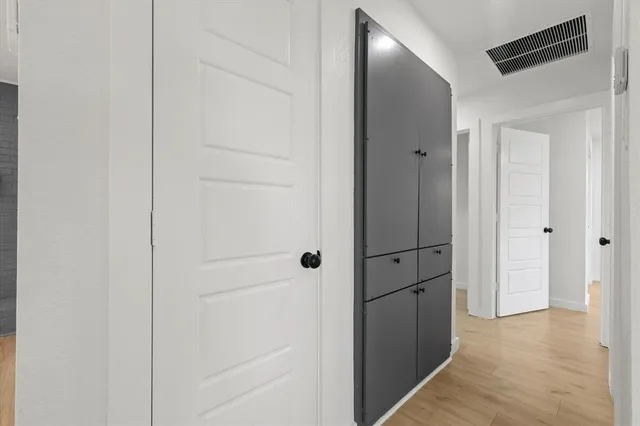 a view of a hallway with closet area