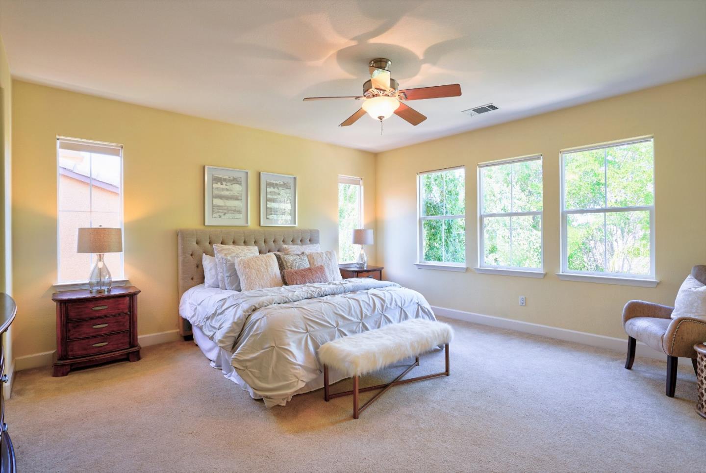 2915 Silva Way San Ramon, CA 94582 - Photo 23 of 38 a spacious bedroom with a bed and a couch