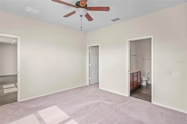 a room that has a bed and a table in it