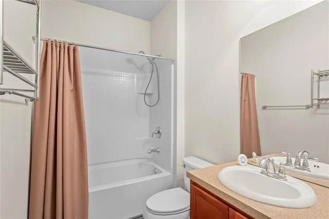 a view of a yard in front of a house with a garden