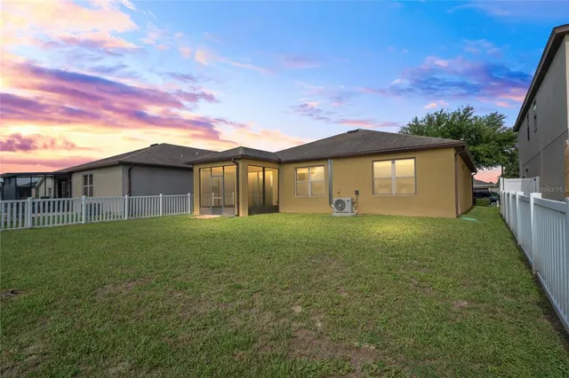 an aerial view of a house with a garden