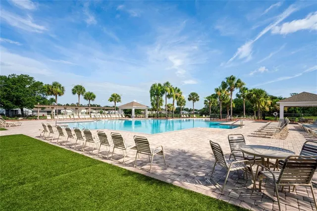 a front view of a house with a garden and yard