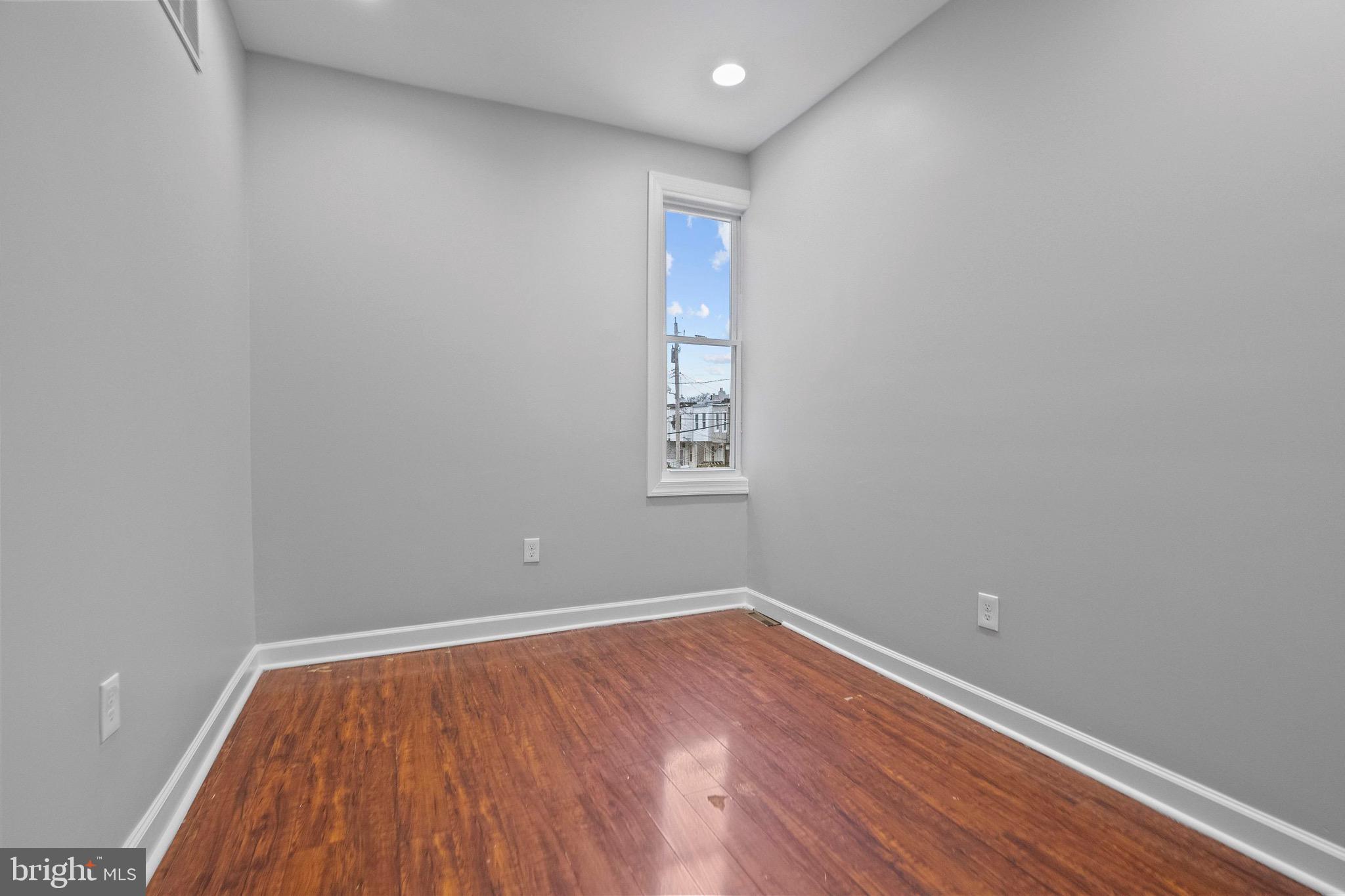 2706 Greenmount Avenue Baltimore, MD 21218 - Photo 11 of 20 a view of room with wooden floor and fan