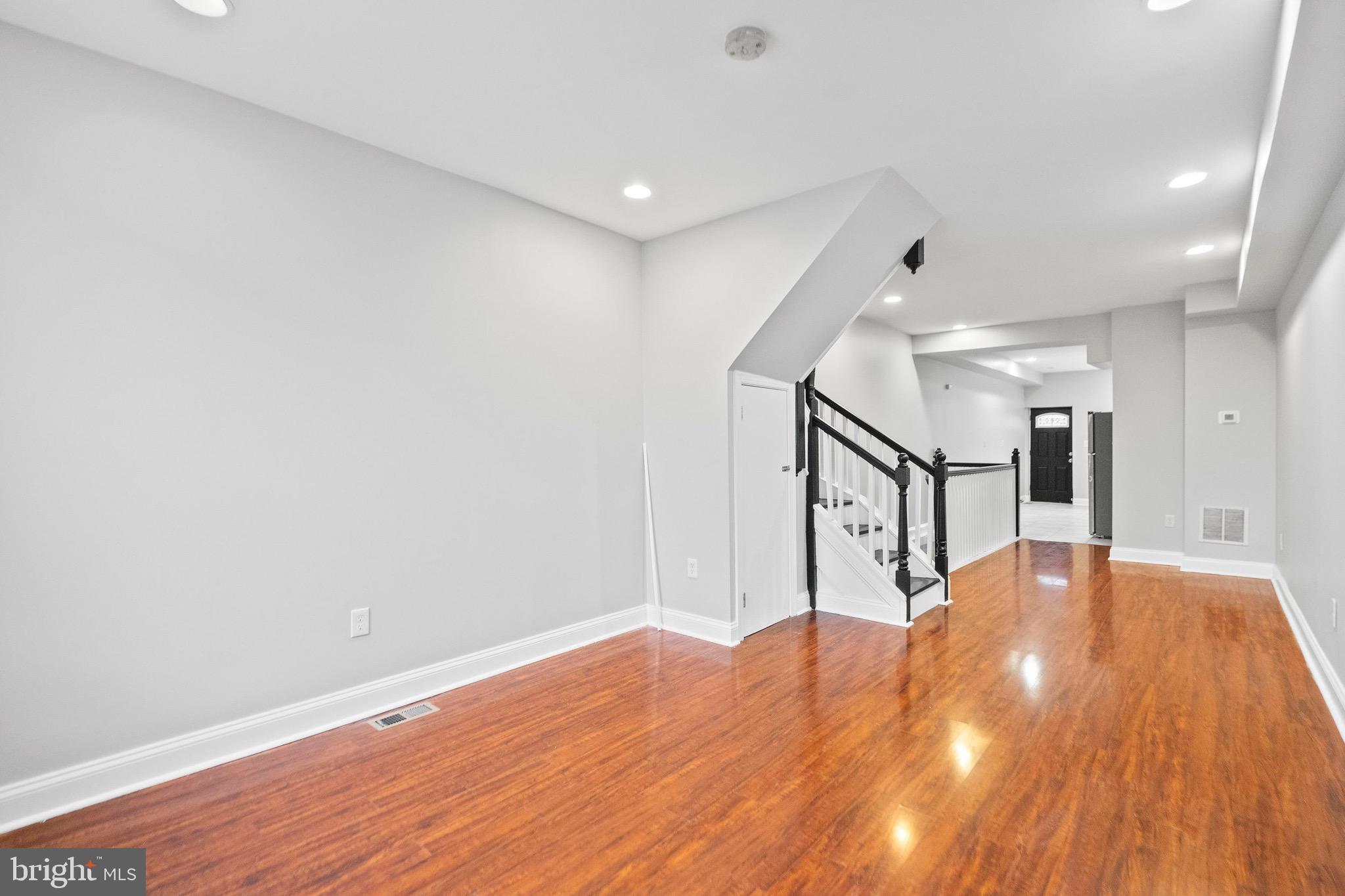 2706 Greenmount Avenue Baltimore, MD 21218 - Photo 5 of 20 a view of empty room with wooden floor