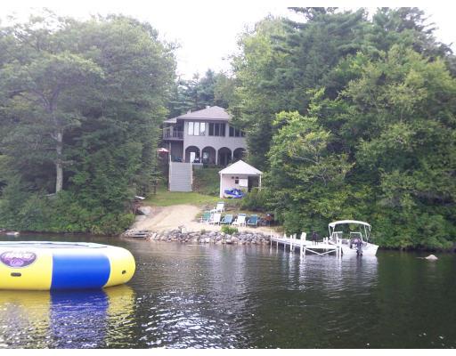 70 Stowell Road Ashburnham, MA 01430 - Photo 13 of 17 a view of a lake with a house in the background