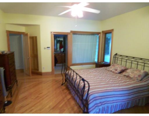 70 Stowell Road Ashburnham, MA 01430 - Photo 7 of 17 a bedroom with a bed and a flat screen tv