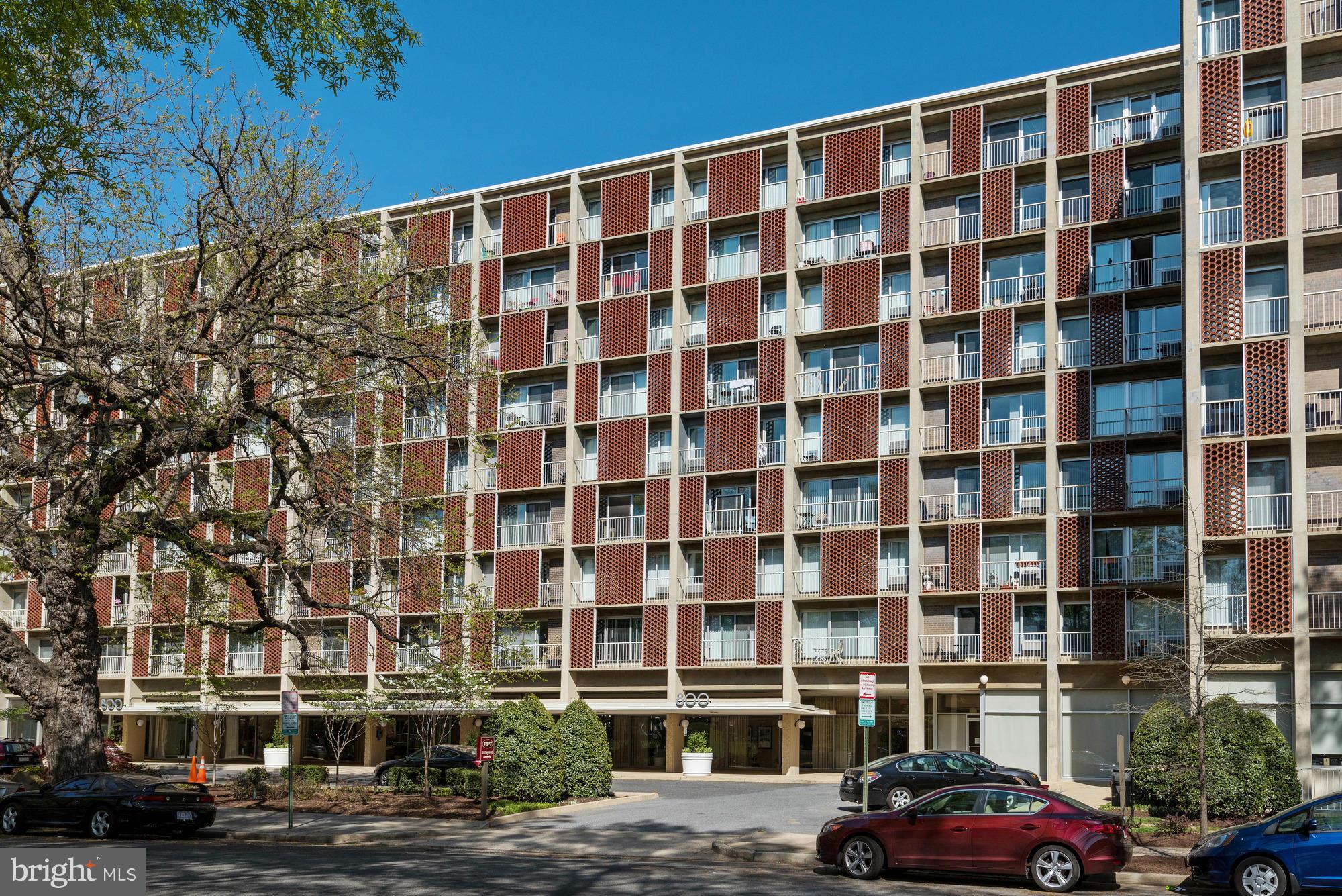 800 4th Street Southwest, Unit S615 Washington, DC 20024 - Photo 2 of 28 a front view of a building with lot of cars parked in front of it