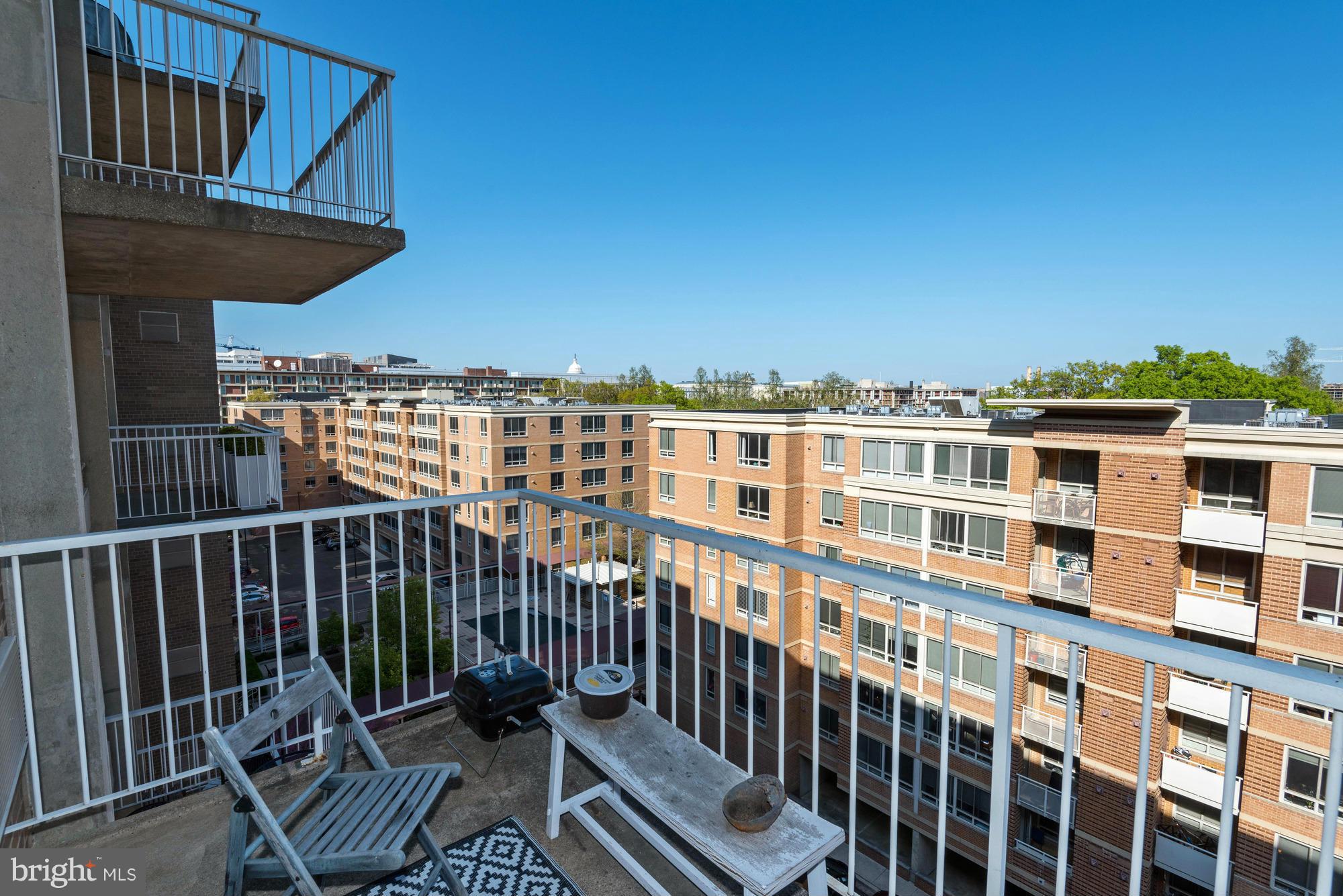 800 4th Street Southwest, Unit S615 Washington, DC 20024 - Photo 16 of 28 a view of a balcony with chairs