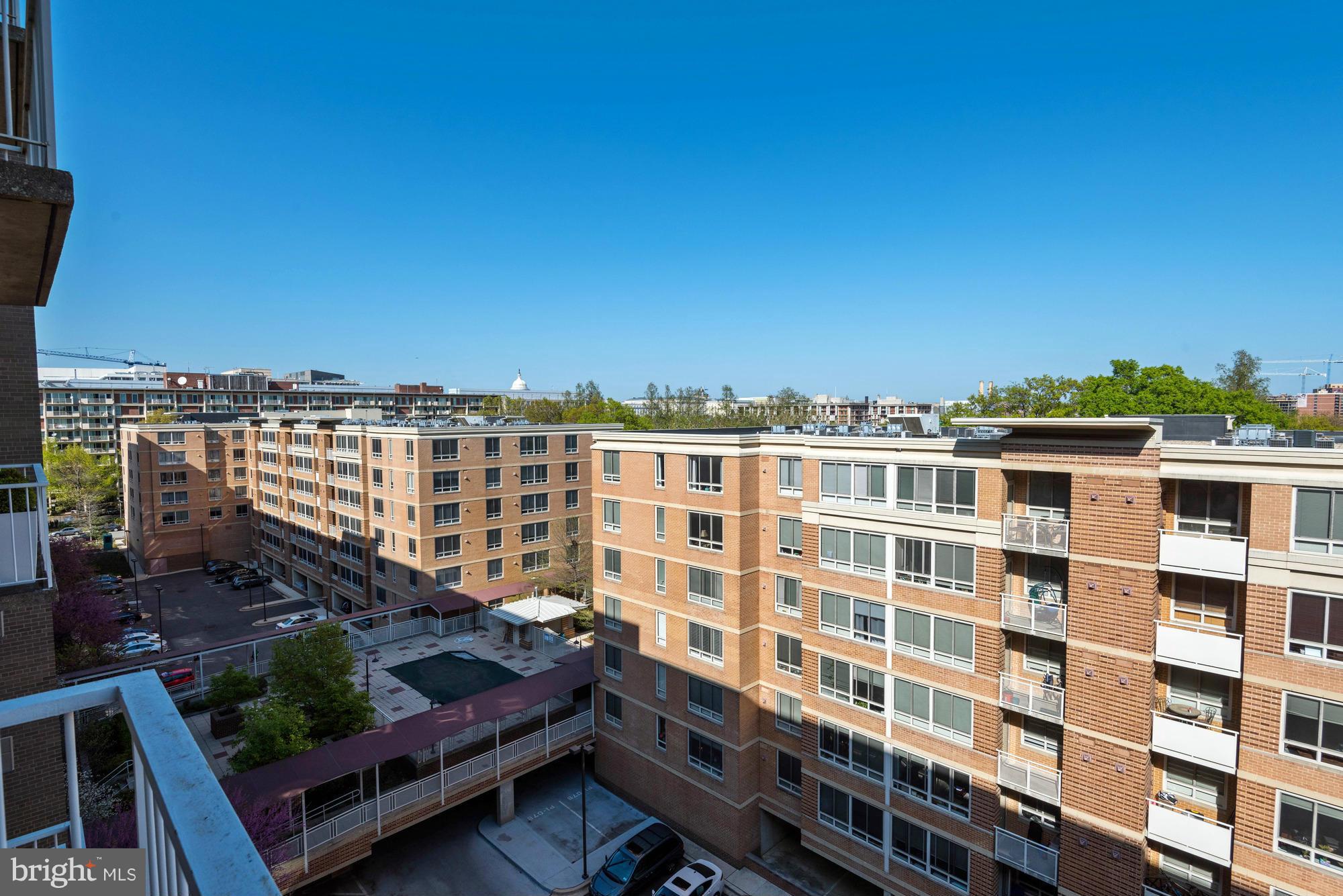 800 4th Street Southwest, Unit S615 Washington, DC 20024 - Photo 17 of 28 a view of a tall building from a balcony