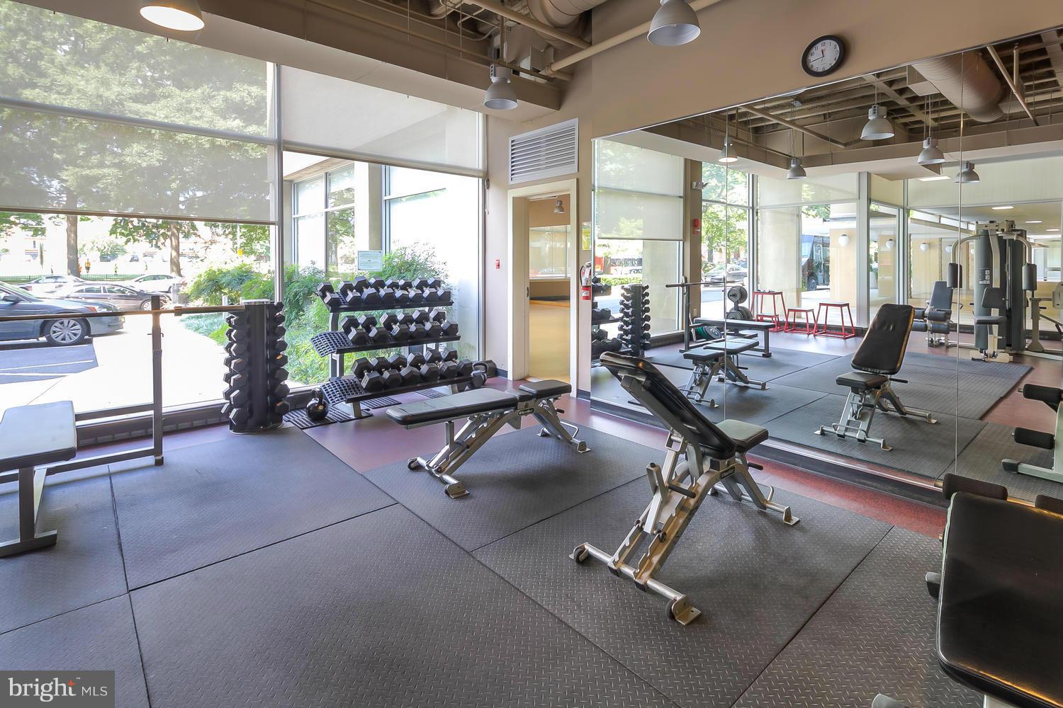800 4th Street Southwest, Unit S615 Washington, DC 20024 - Photo 22 of 28 a room with gym equipment and large windows