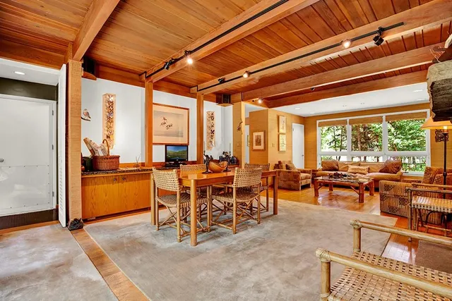 a view of a dining room with furniture window and outside view