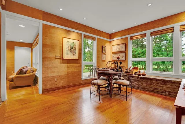 a living room with furniture and large windows