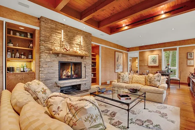 a bedroom with furniture and a fireplace