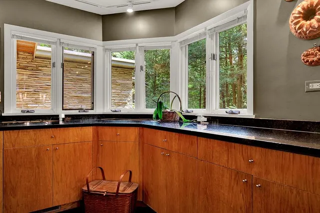 a view of a large tub and chair in a room