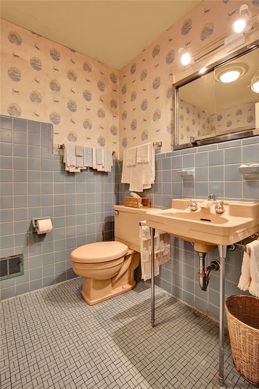 114 Forelle Lane Ligonier, PA 15658 - Photo 27 of 43 a bathroom with a sink a toilet and a mirror