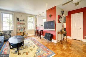 2719 Ordway Street Northwest, Unit 6 Washington, DC 20008 - Photo 3 of 12 a living room filled with furniture and a table