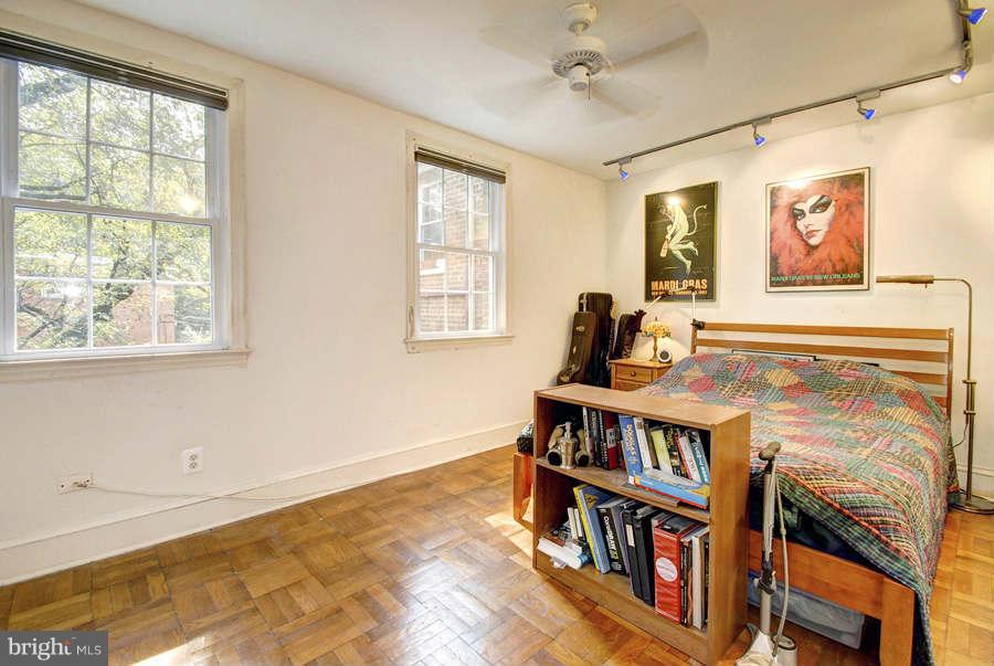 2719 Ordway Street Northwest, Unit 6 Washington, DC 20008 - Photo 10 of 12 a living room with lots of books and a window