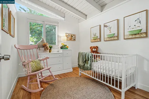 a bedroom with furniture and a window