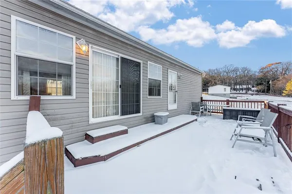 a view of a balcony with furniture