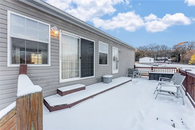 a view of a balcony with furniture
