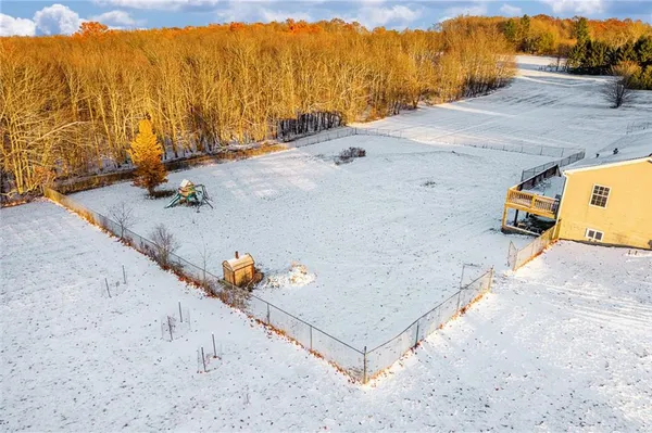 an aerial view of residential houses with outdoor space